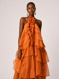 3D rosette neckline detail on Jovellee orange chiffon dress