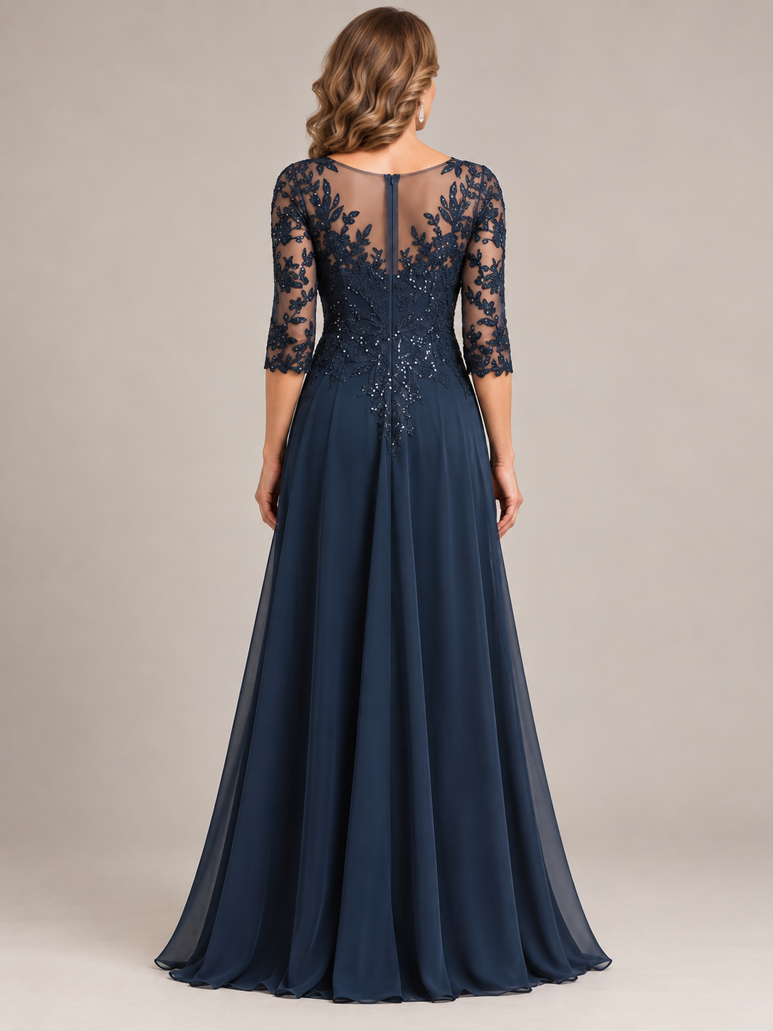 Back view of a navy blue A-line mother of the bride gown with a floor-length skirt and elegant formal silhouette