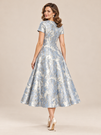 Back view of blue floral tea-length formal dress with short sleeves
