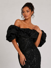 Oversized ruffle neckline on black sequin prom dress