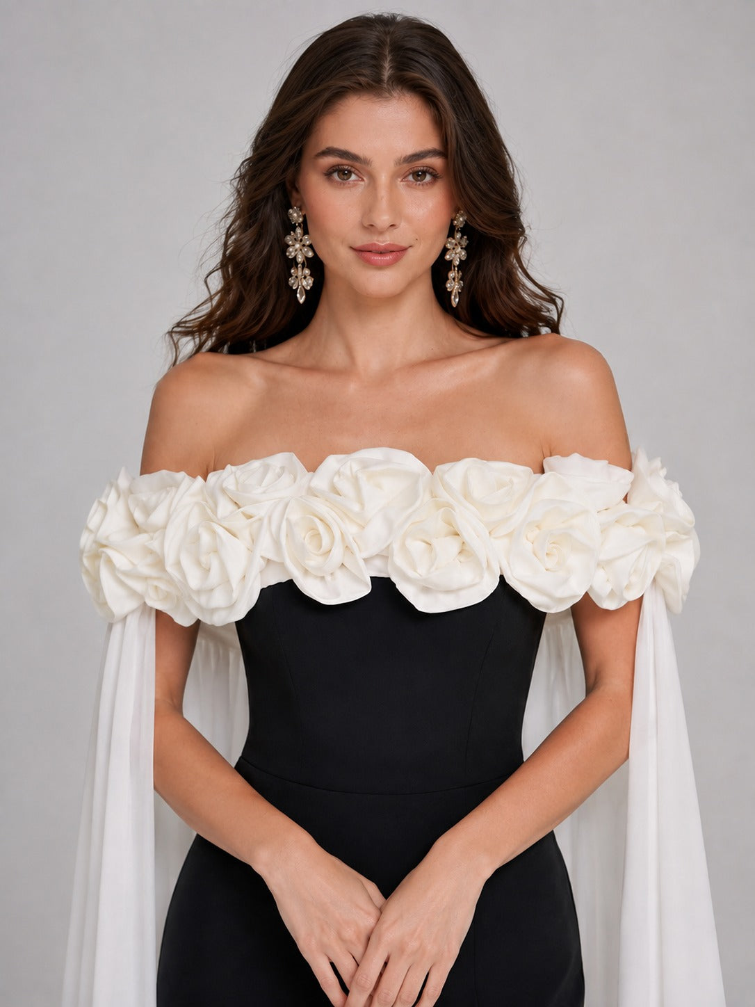 Black fitted prom dress with ivory floral cape side view
