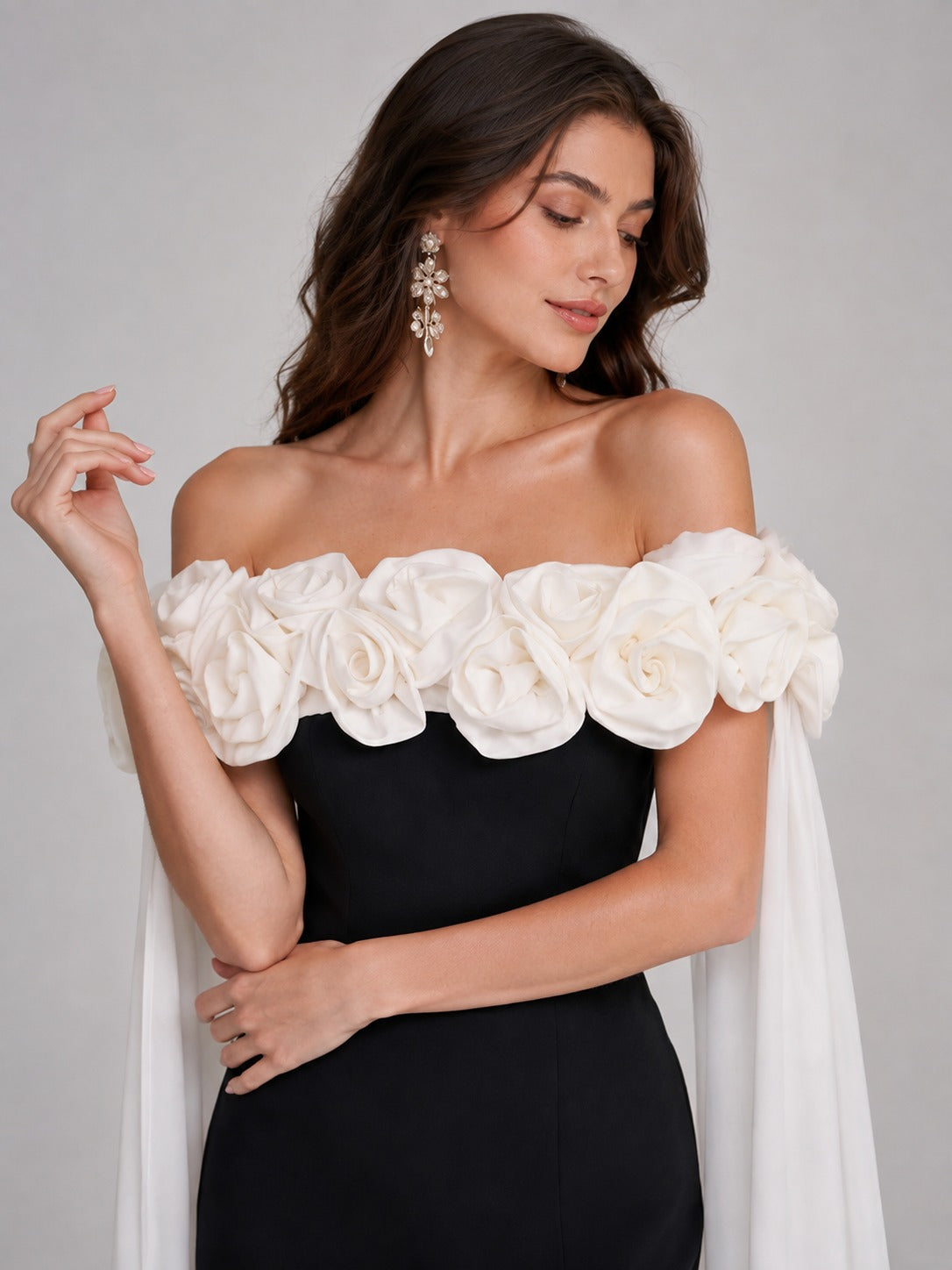 Ivory 3D floral appliqués on black off-shoulder prom dress
