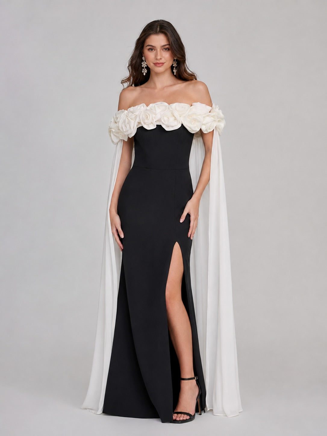 Flowing ivory cape on black floral prom dress