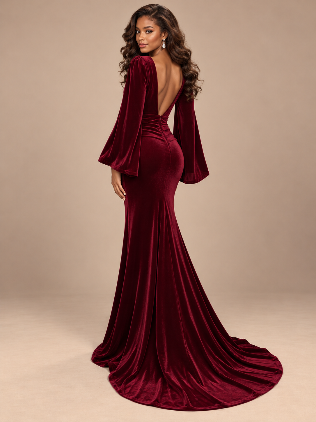 Full-length burgundy velvet formal gown by Jovellee with a figure-skimming fit and softly flared hem