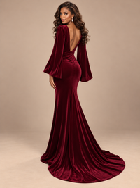 Full-length burgundy velvet formal gown by Jovellee with a figure-skimming fit and softly flared hem