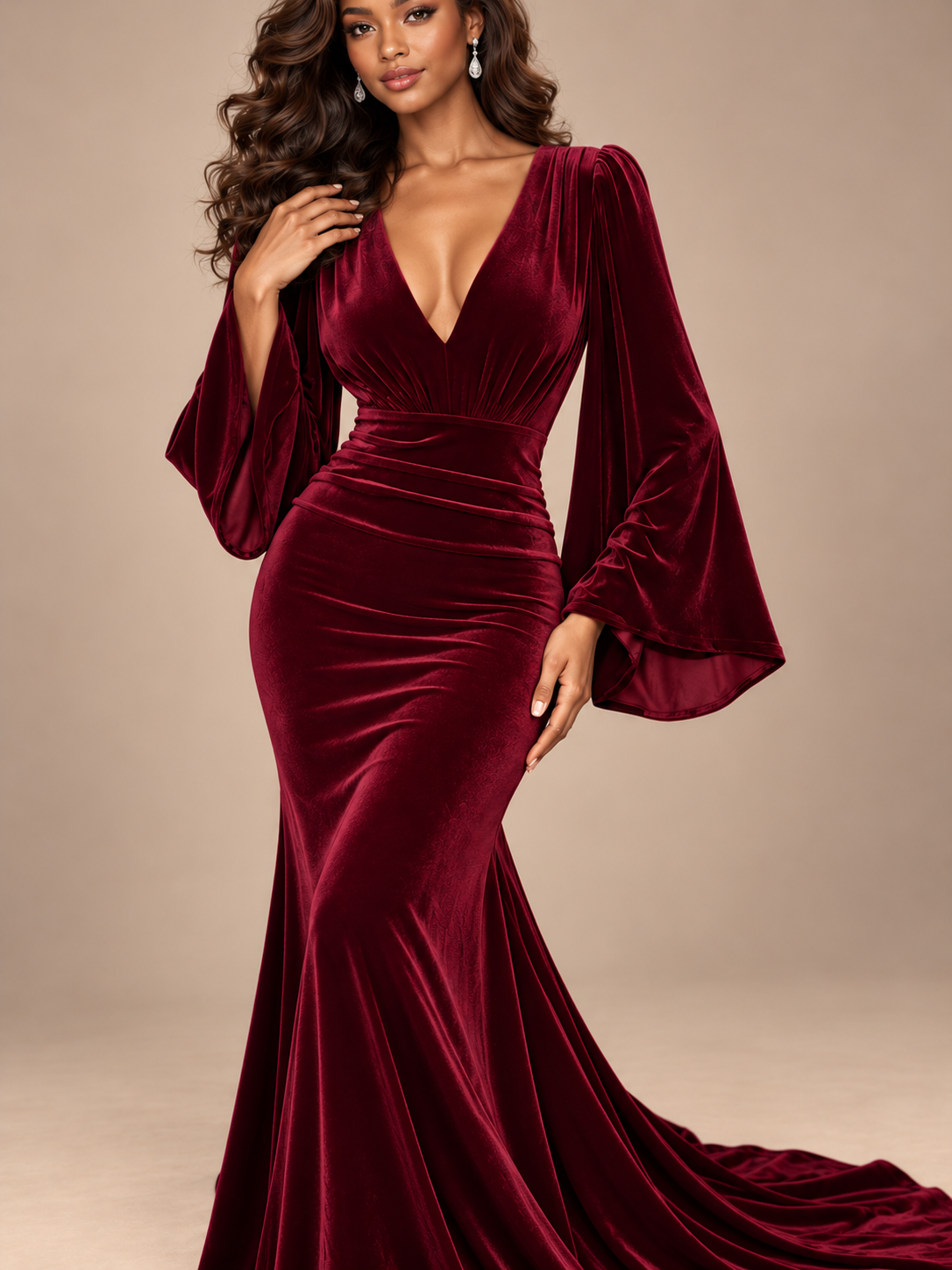 Ruched waist detail of Jovellee burgundy velvet formal dress with a fitted silhouette