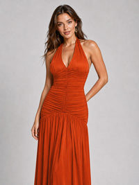 Ruched fitted bodice on burnt orange prom dress