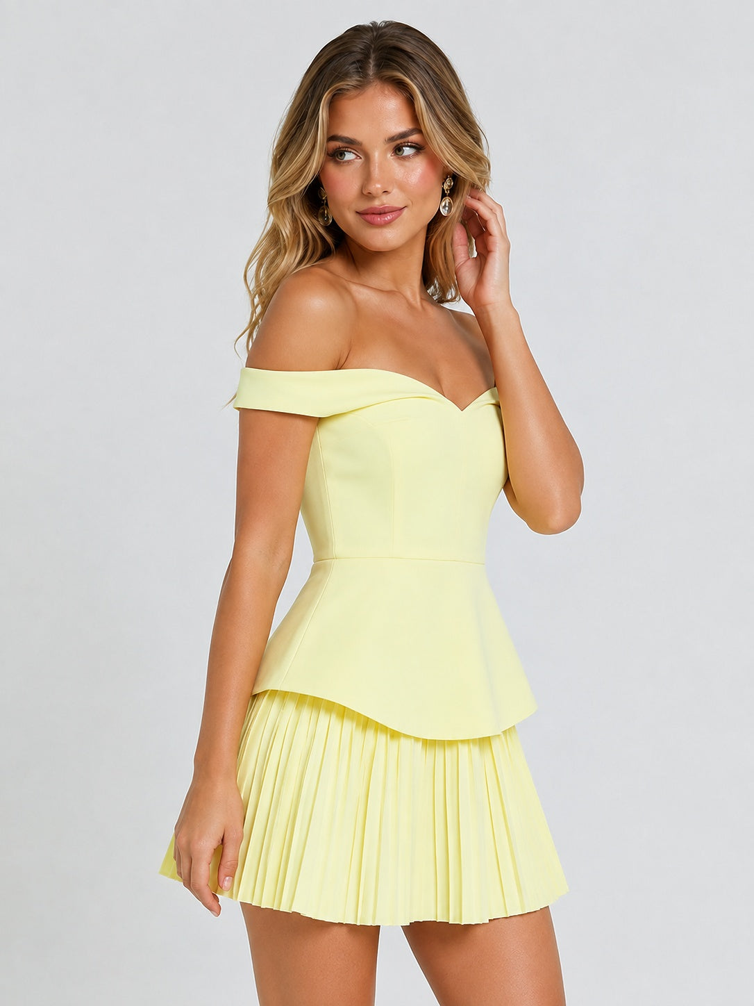 Sweetheart off-shoulder neckline on butter yellow mini dress