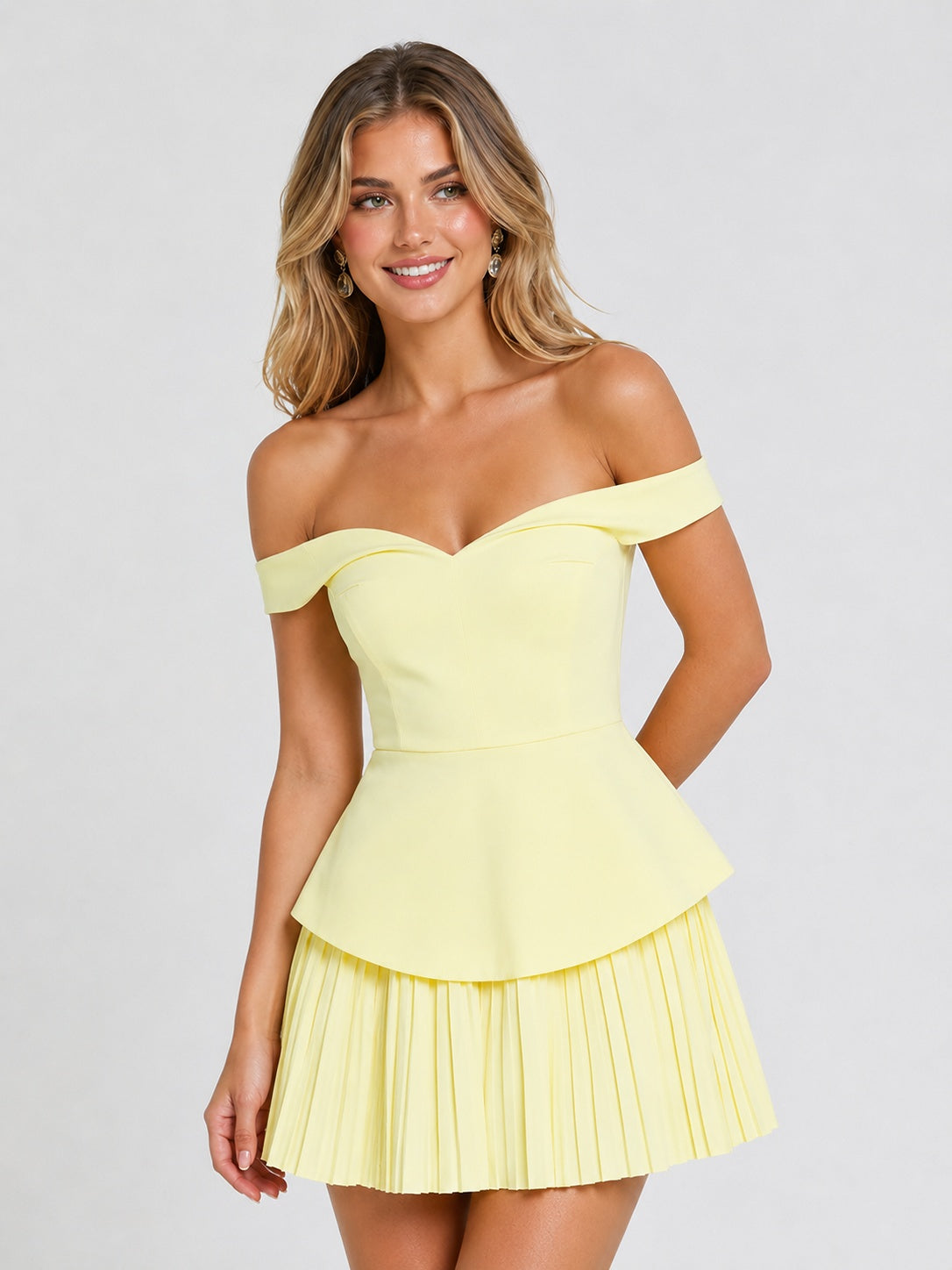 Peplum waist detail on yellow mini dress