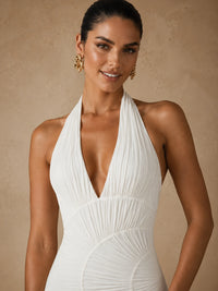 Close-up of the Calista white chiffon halter wedding dress with a plunging V-neckline and gathered bodice