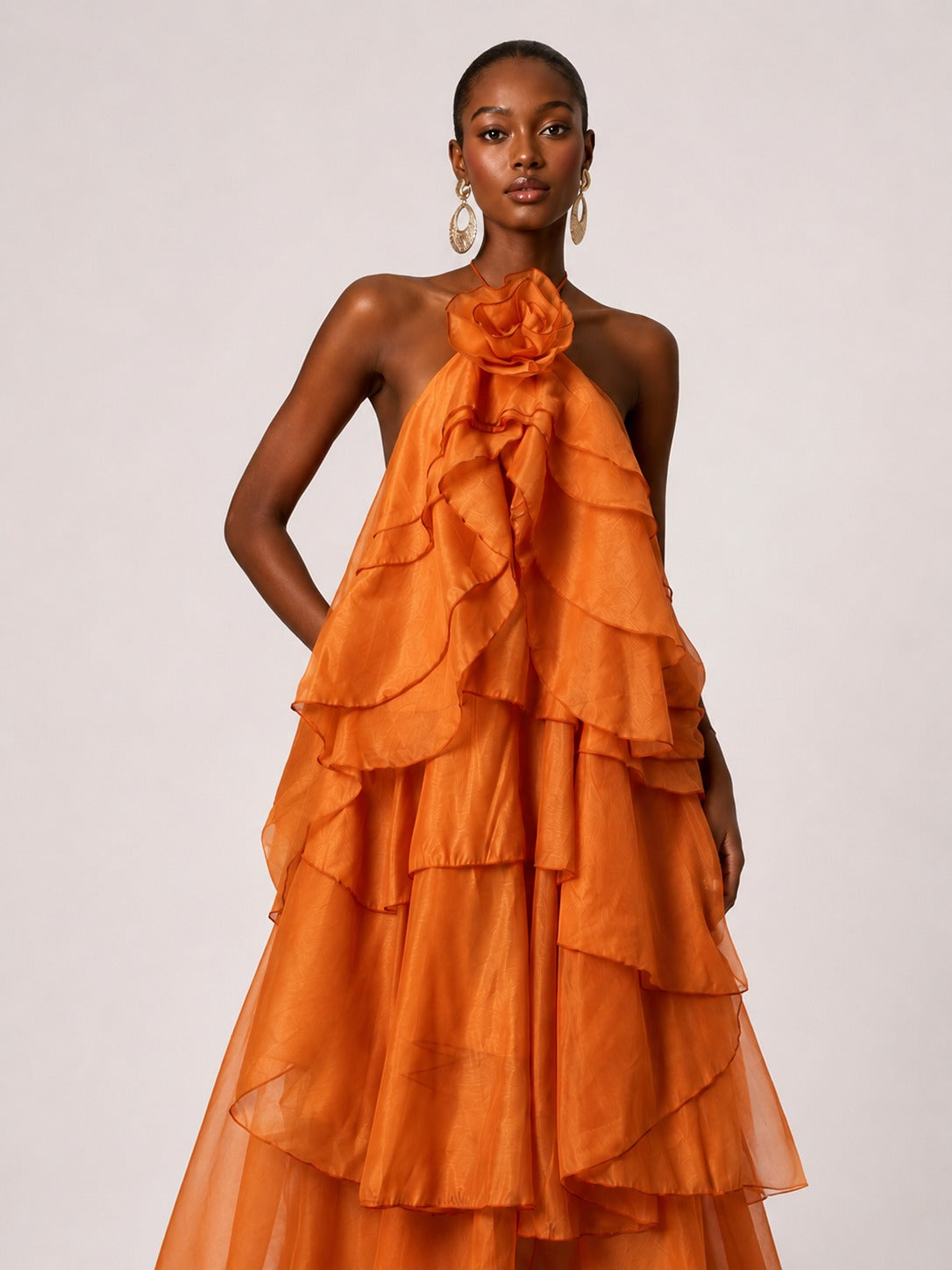 Cascading ruffle detail on Jovellee orange chiffon maxi dress