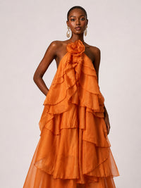 Cascading ruffle detail on Jovellee orange chiffon maxi dress
