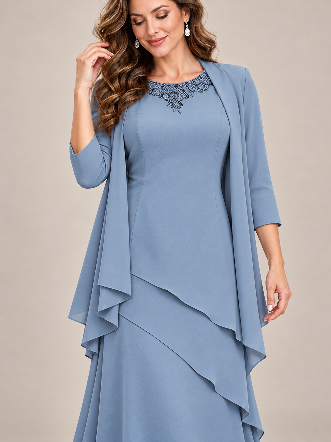 Close-up of embellished round neckline on dusty blue Jovellee chiffon formal dress
