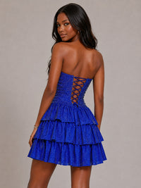 Close-up of royal blue sequin fabric and tiered ruffle detail on Jovellee mini dress