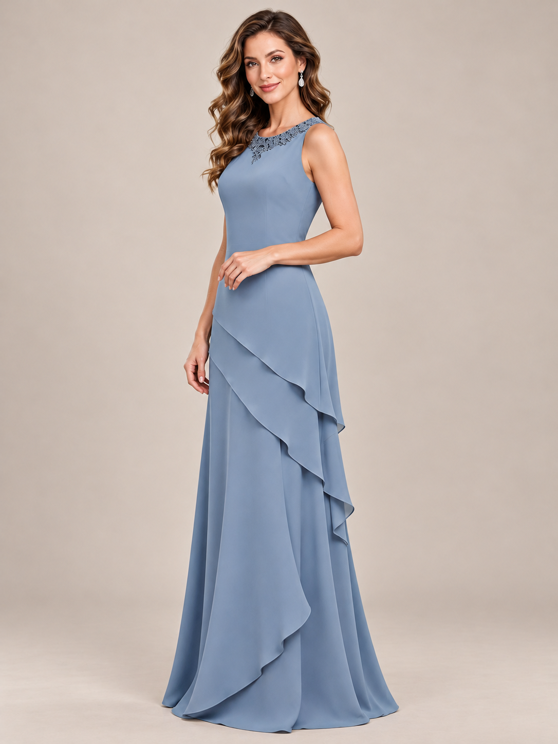 Dusty blue floor-length chiffon mother of the bride dress styled without its removable jacket