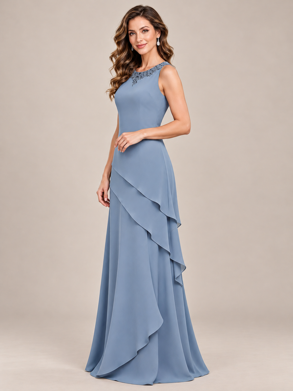 Dusty blue floor-length chiffon mother of the bride dress styled without its removable jacket