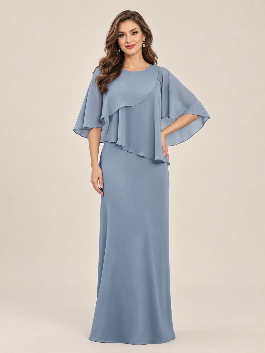 Dusty blue formal gown with flowing cape sleeves, round neckline and floor-length column skirt