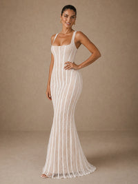 Three-quarter front view of the Jovellee Elise white lace mermaid wedding dress with square neckline