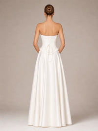 Back view of the Evangeline strapless satin ball gown wedding dress with lace-up corset closure