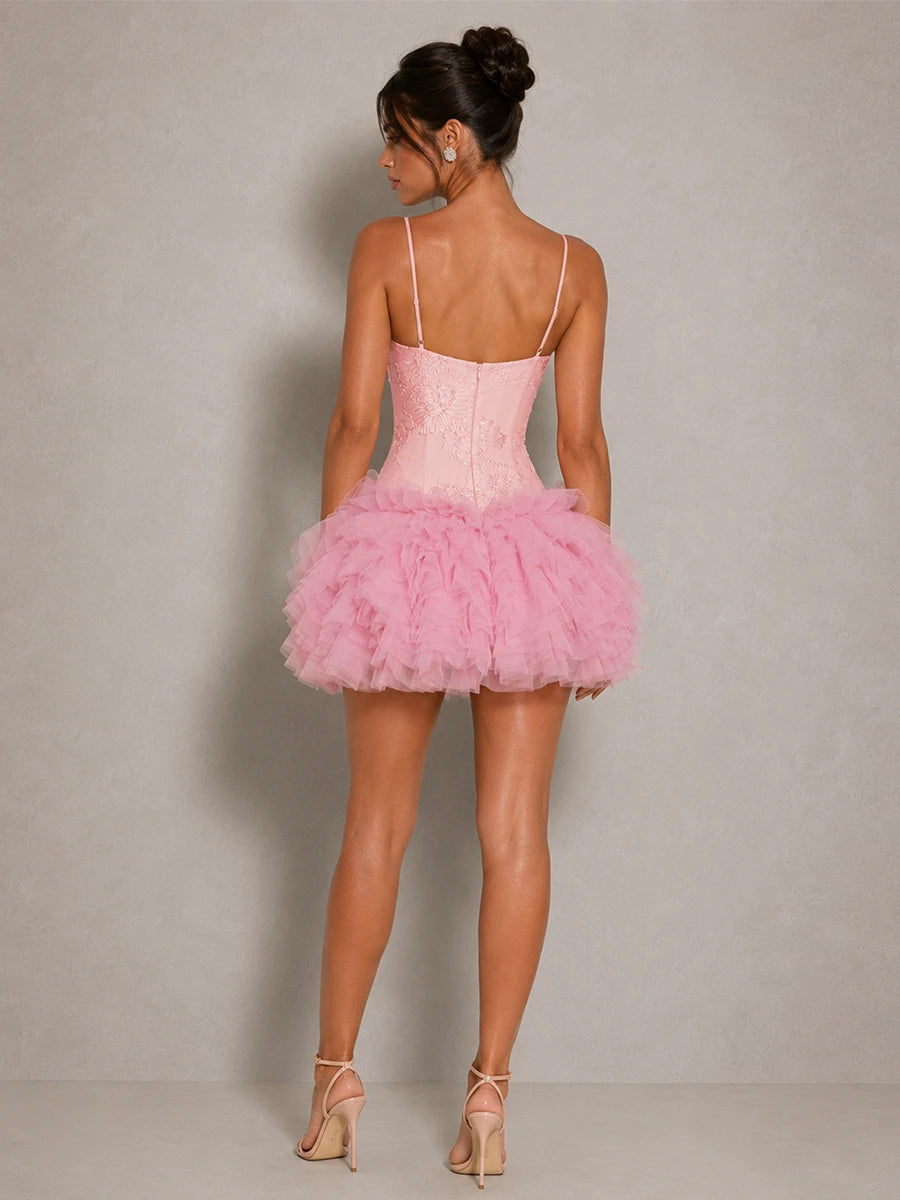 Back view of the Fiora pink corset tulle mini dress with slender straps, fitted bodice and ruffle skirt
