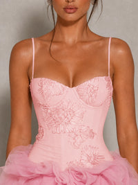Close-up of the Fiora pink corset mini dress with floral applique bodice and layered tulle ruffle skirt