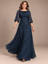 Floor-length A-line navy blue gown with scattered floral lace appliqués and subtle sequins