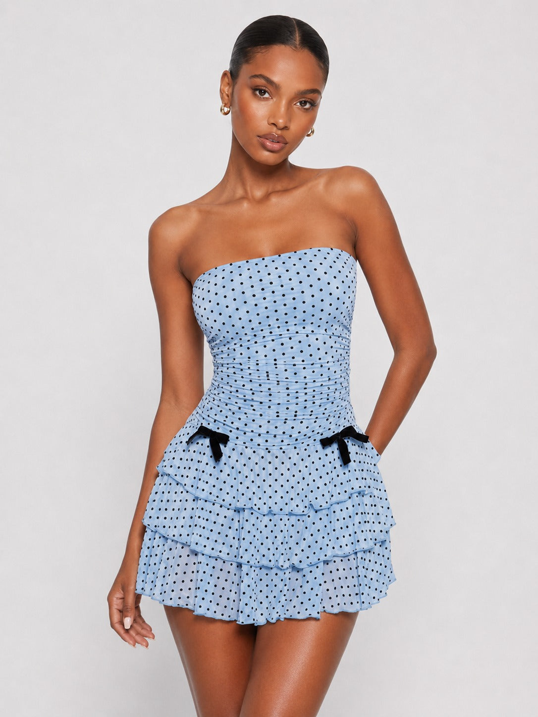 Front view of Jovellee blue polka dot strapless mini dress
