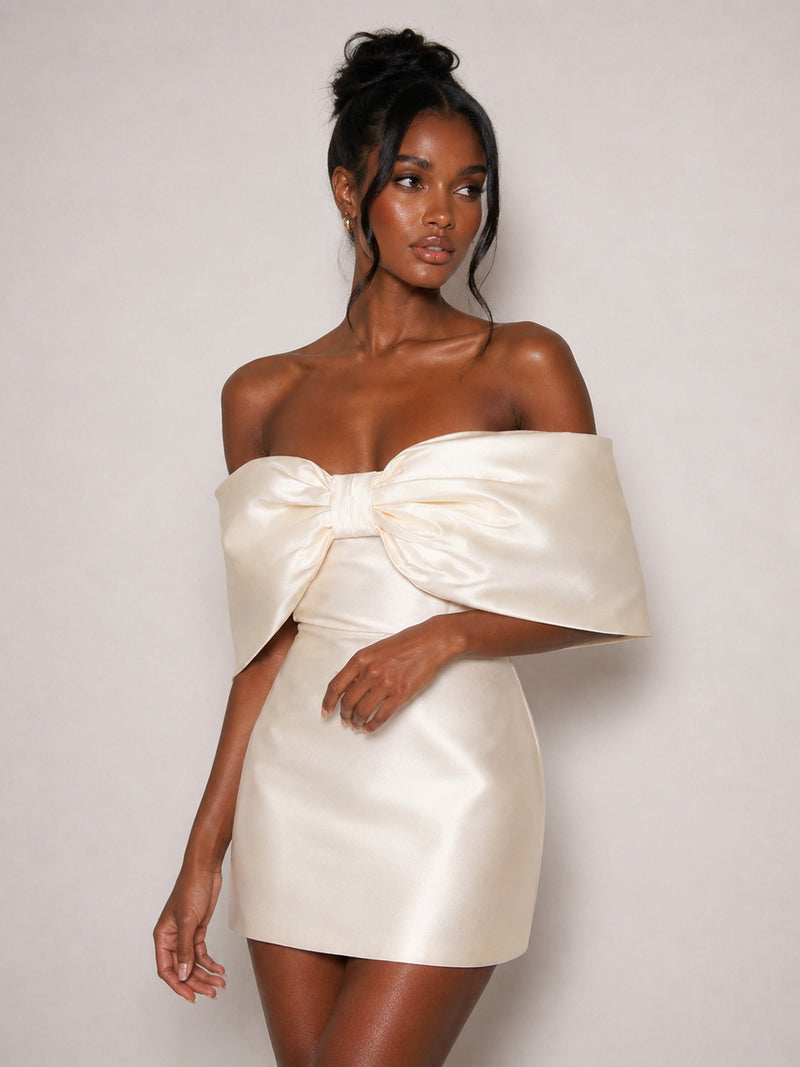 Front view of ivory satin oversized bow mini dress
