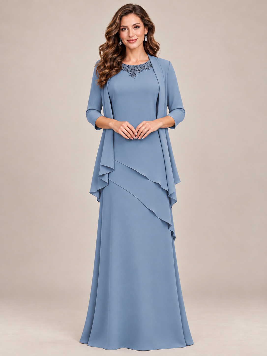 Full-length dusty blue mother of the bride gown with embellished neckline and matching chiffon jacket