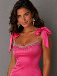 Close-up of the sequin-embellished scoop neckline and satin bow straps on the Jovellee Valentina mini dress