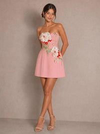 Full-length front view of the Isadora pink strapless mini dress with 3D floral applique and A-line skirt