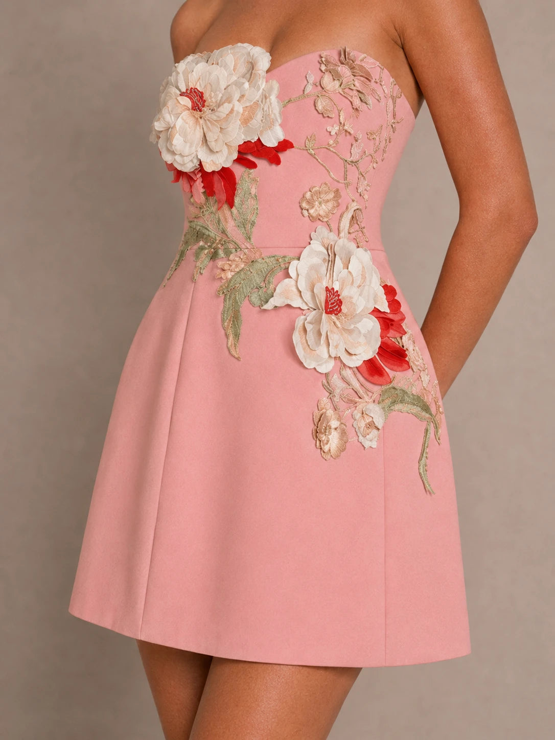 Detail view of 3D floral applique and botanical embroidery on the Isadora pink chiffon mini dress
