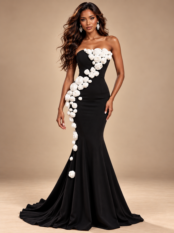 Jovellee black strapless mermaid prom dress with cascading 3D white roses and a floor-length flared skirt, front view