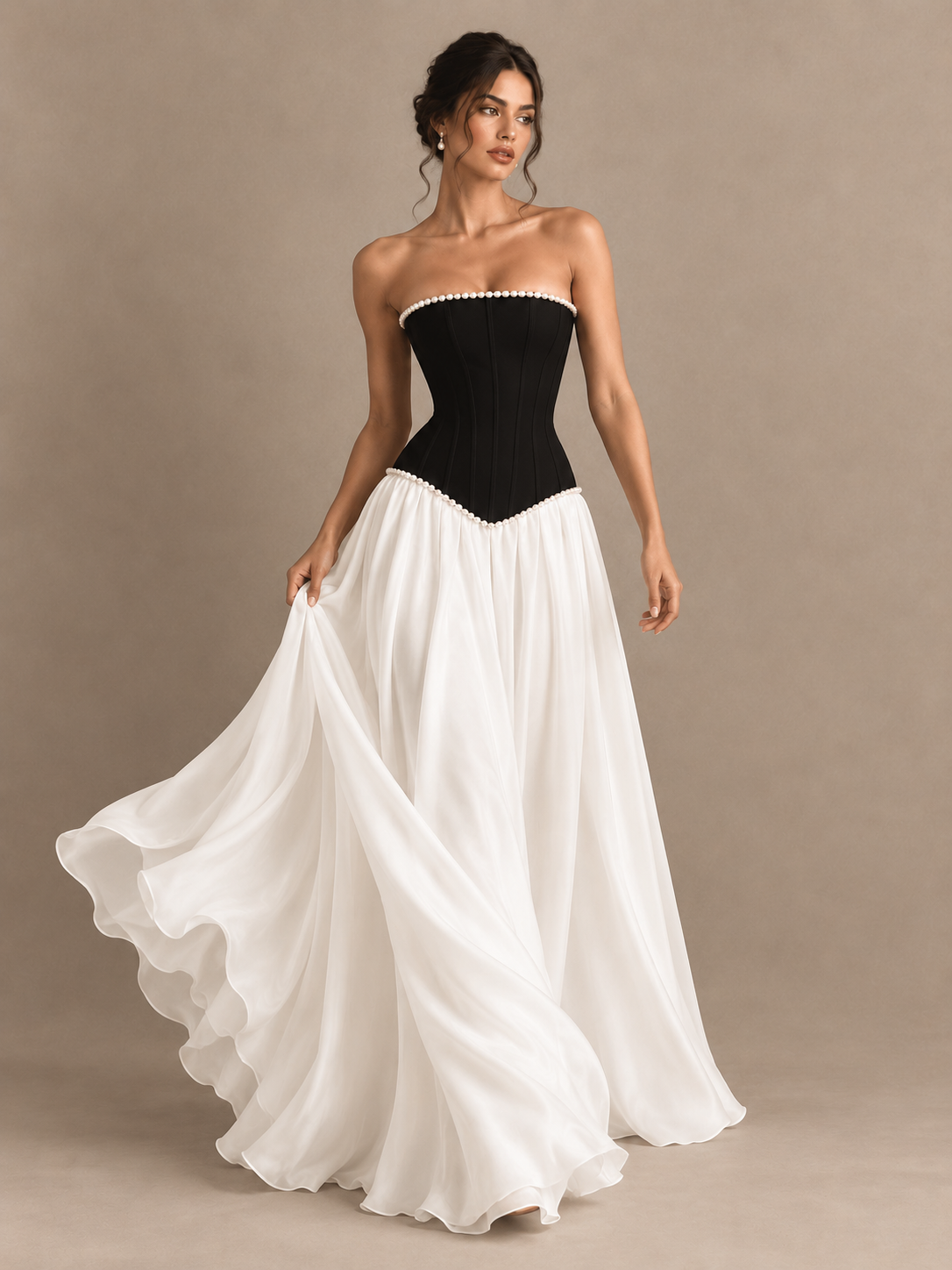 Jovellee pearl-trimmed strapless evening gown with a black corset-style bodice and long white skirt