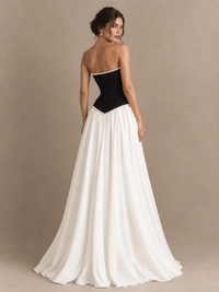 Black and white basque waist prom dress with a pearl-trimmed neckline and flowing A-line skirt by Jovellee
