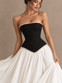 Jovellee two-tone black and white prom gown with a fitted strapless bodice and elegant flowing skirt