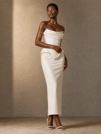 Three-quarter front view of the Mira white satin strapless wedding dress with a corset bodice