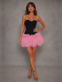 Front view of the Odette black and pink strapless corset mini dress with voluminous mesh skirt