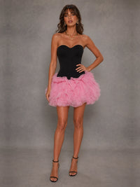 Full-length front view of the Jovellee Odette black corset mini dress with pink tulle ruffle skirt