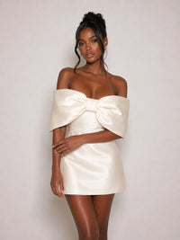 Oversized bow detail on ivory satin mini dress