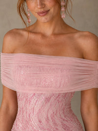 Close-up of the draped off-shoulder neckline and pink sequin detailing on the Jovellee Rosalie mini dress