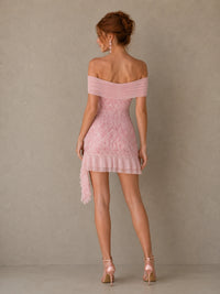 Back view of the Rosalie pink sequin mini dress with an off-shoulder neckline, fitted shape and ruffle hem
