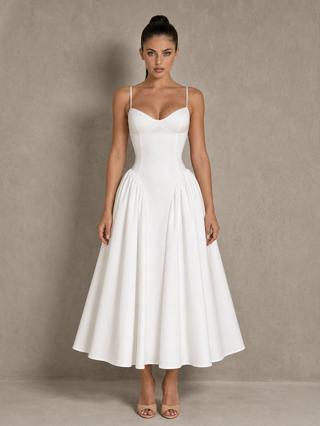 Full-length front view of the Jovellee Rosaline white sweetheart Basque-waist midi wedding dress in a standing pose