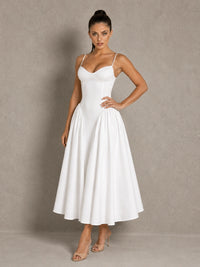 Full-length front view of the Jovellee Rosaline white Basque-waist midi wedding dress with the A-line skirt spread