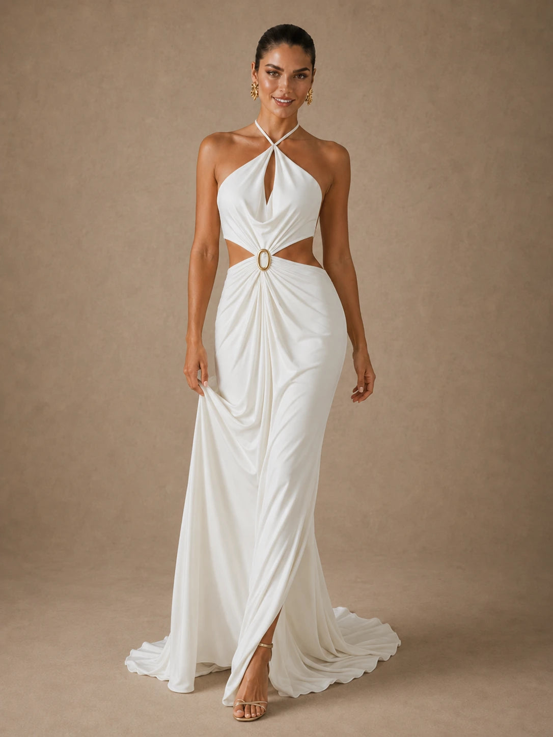 Full-length angled view of the Jovellee Selene ivory chiffon halter cutout maxi dress with gold ring