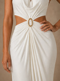 Close-up of the gold-tone oval ring, waist cutouts and gathered chiffon draping on the Selene maxi dress