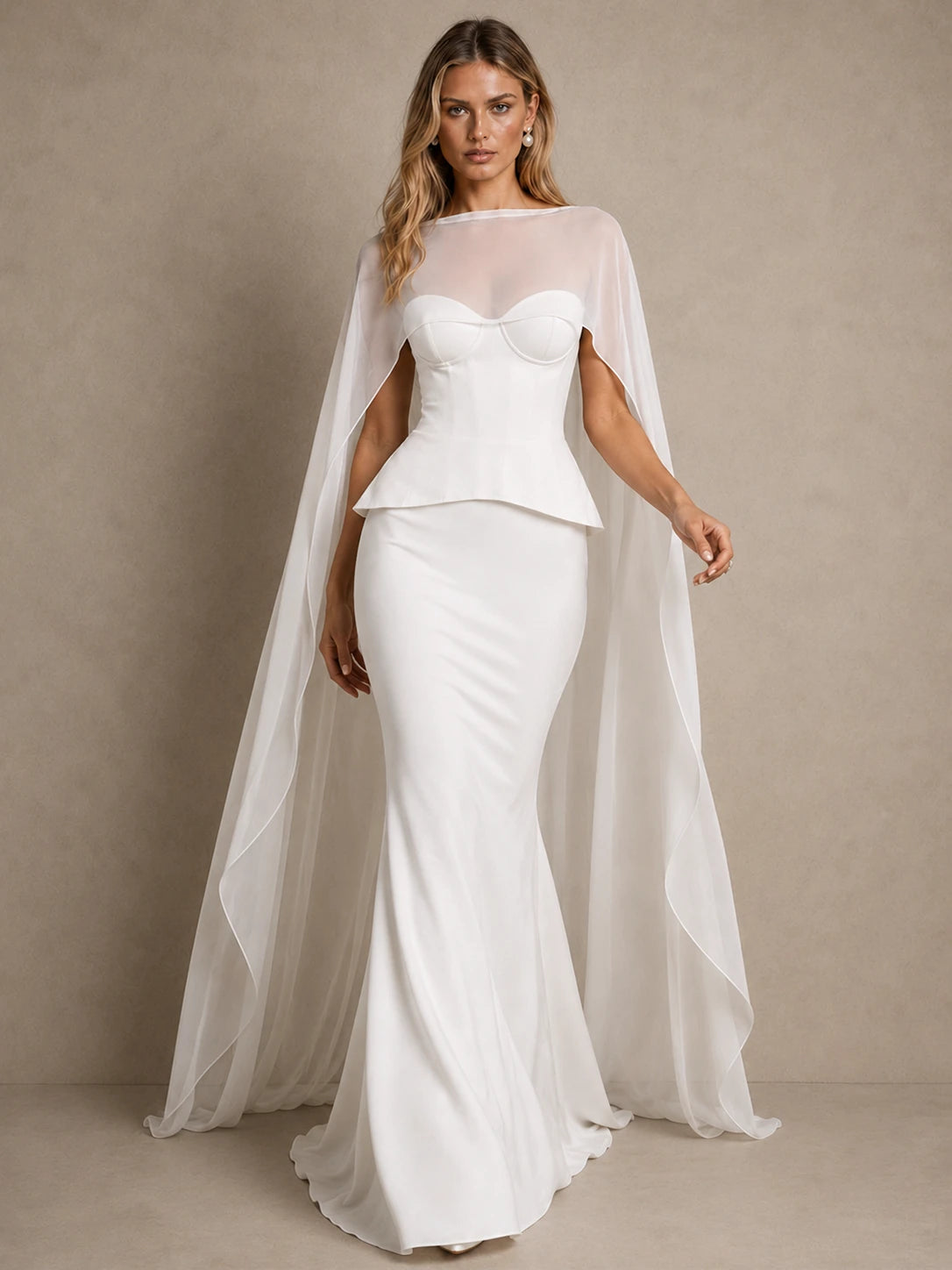 Seraphina white mermaid wedding gown with sculpted corset bodice and flowing sheer cape