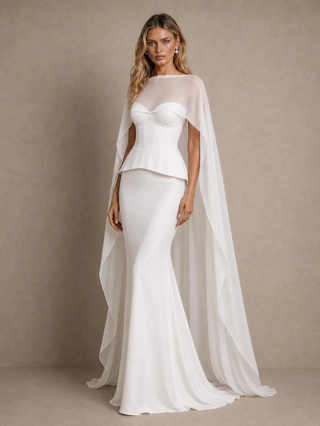 Full-length view of Seraphina white corset wedding dress with peplum waist and sheer bridal cape