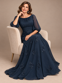 Sheer gathered three-quarter puff sleeves on navy blue mother of the bride gown