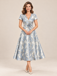 Surplice V-neckline and fitted bodice on blue floral mother of the bride dress